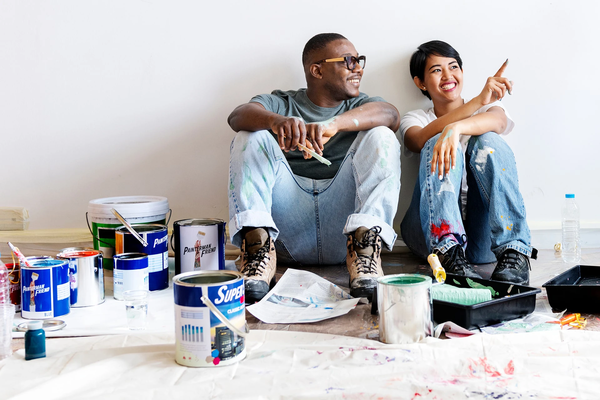 Young Couple Painting Home