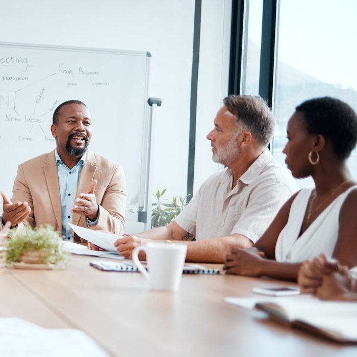 Shot of a group of businesspeople having a meeting at work.