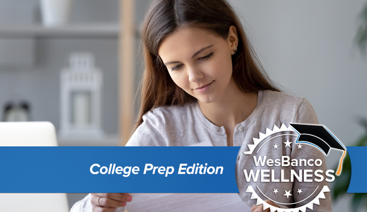 A young student examines her bank document