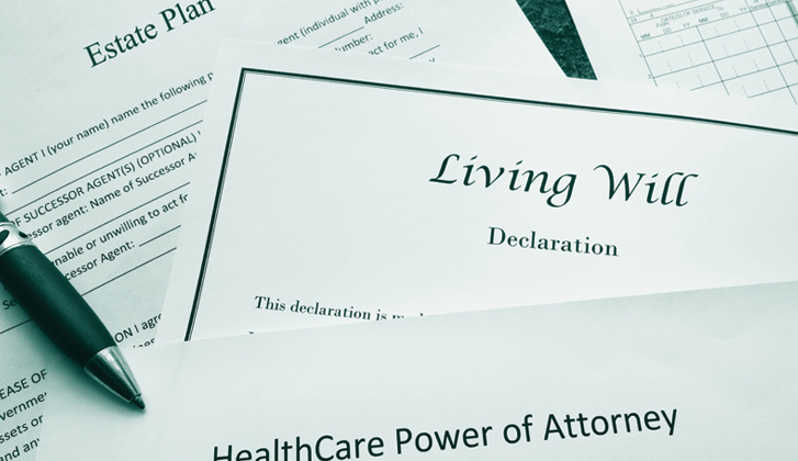 In foreground, document with the words Living Will. In the background, document with the words Estate Plan.