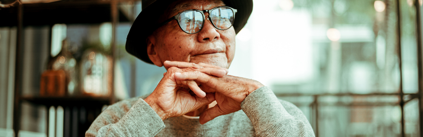 Elderly man with coffee cup