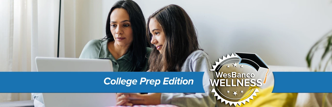 Mom and daughter review FAFSA on a laptop