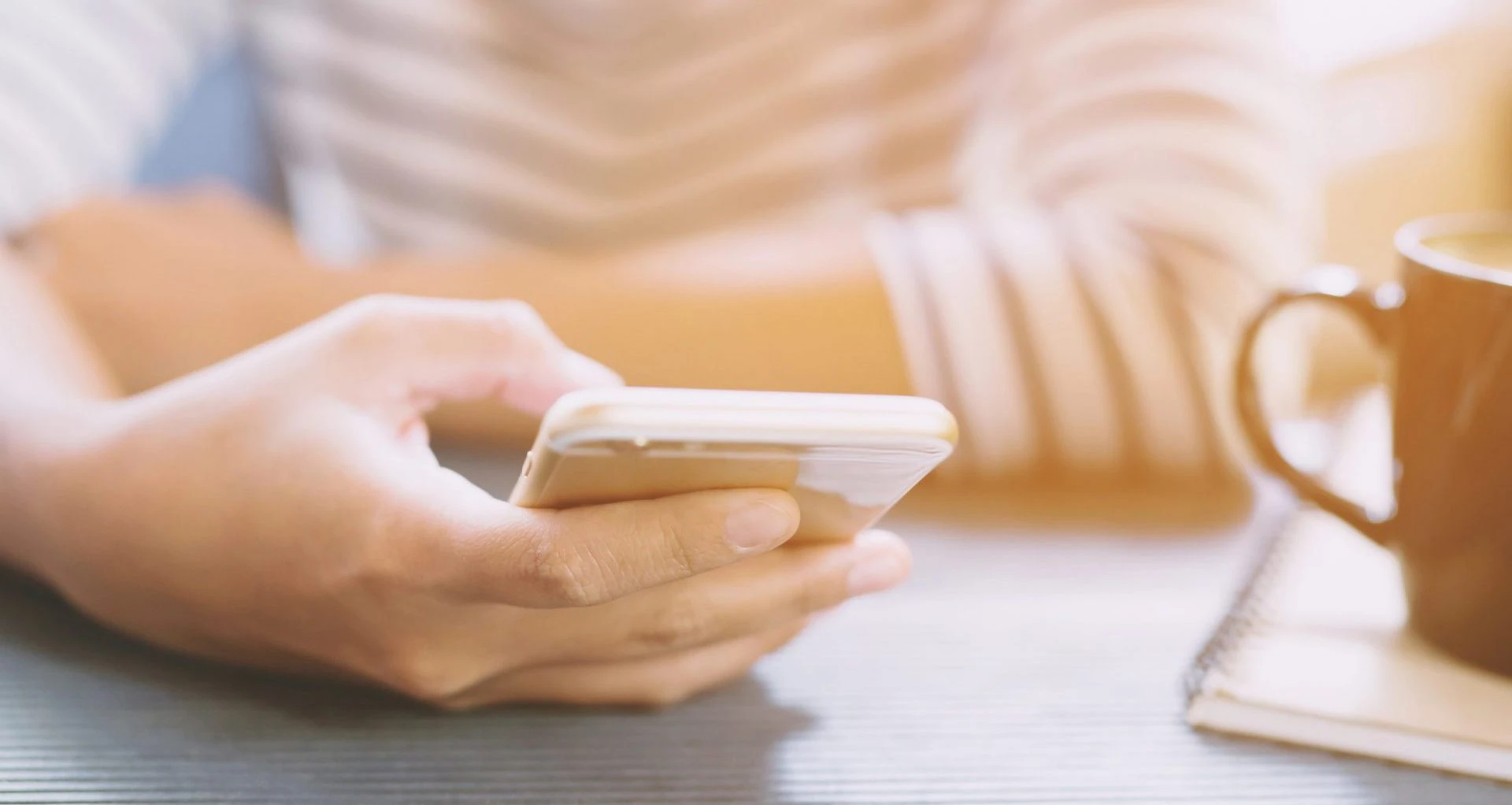 person holding cell phone in hand