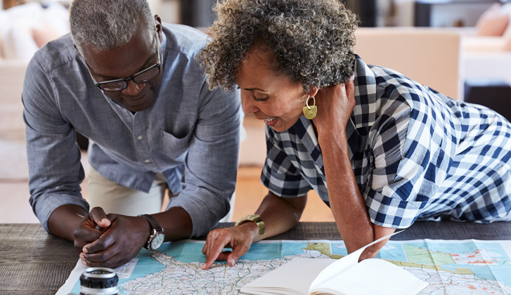 African American couple looking over a map