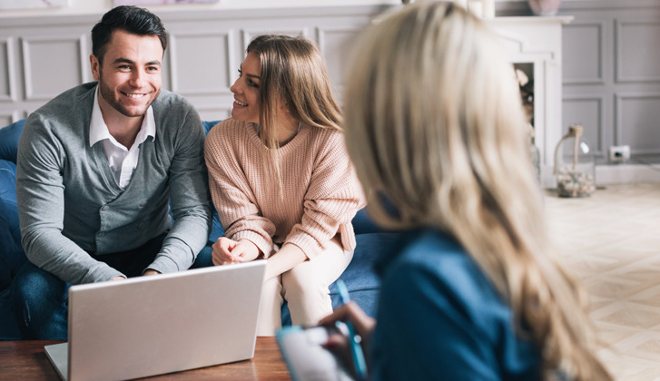 Couple meets with a financial advisor