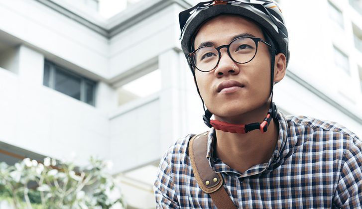 Young man with a bike helmet and nose ring
