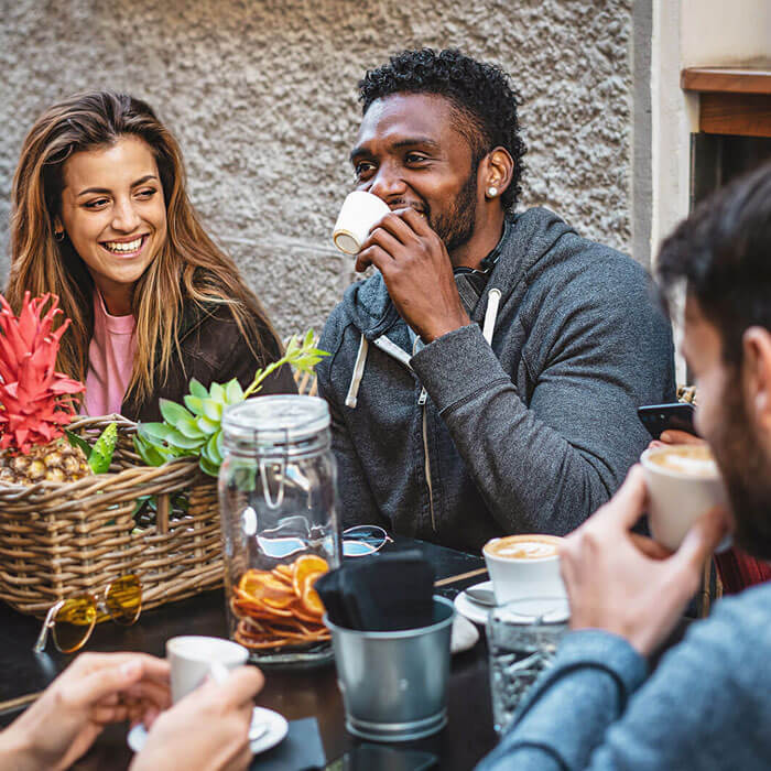 People drinking coffee at an outdoor cafe