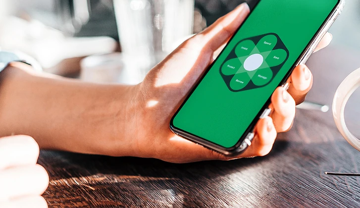 Hand holding smartphone showing WesBanco One