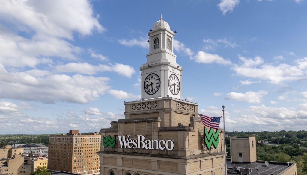 Clocktower in Youngstown, Ohio, with WesBanco's logo and green Flying W on the Building Facade