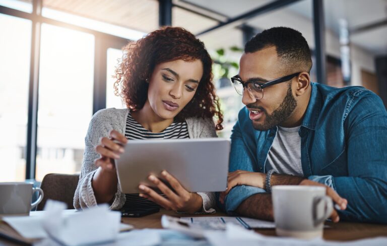 Couple viewing their WesBanco investments on a tablet